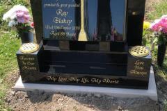 Black granite headstone with gold lettering