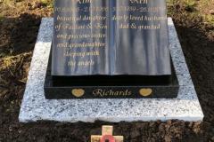 Granite memorial with gold accents — Richards family memorial