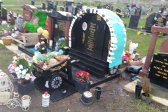 Granite headstone in cemetery setting