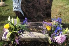Granite headstone with floral motif