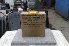 Granite and stone memorial on white base — Walter Ramsey Kibbon