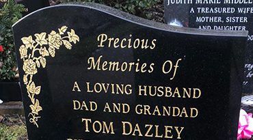 Granite headstone with gold engraving