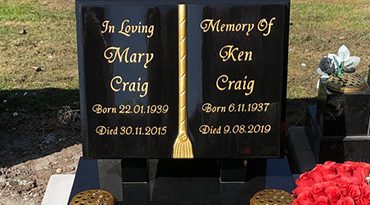 Black granite book-shaped memorial
