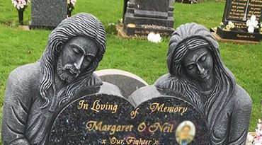 Cemetery memorial stone with angel figures