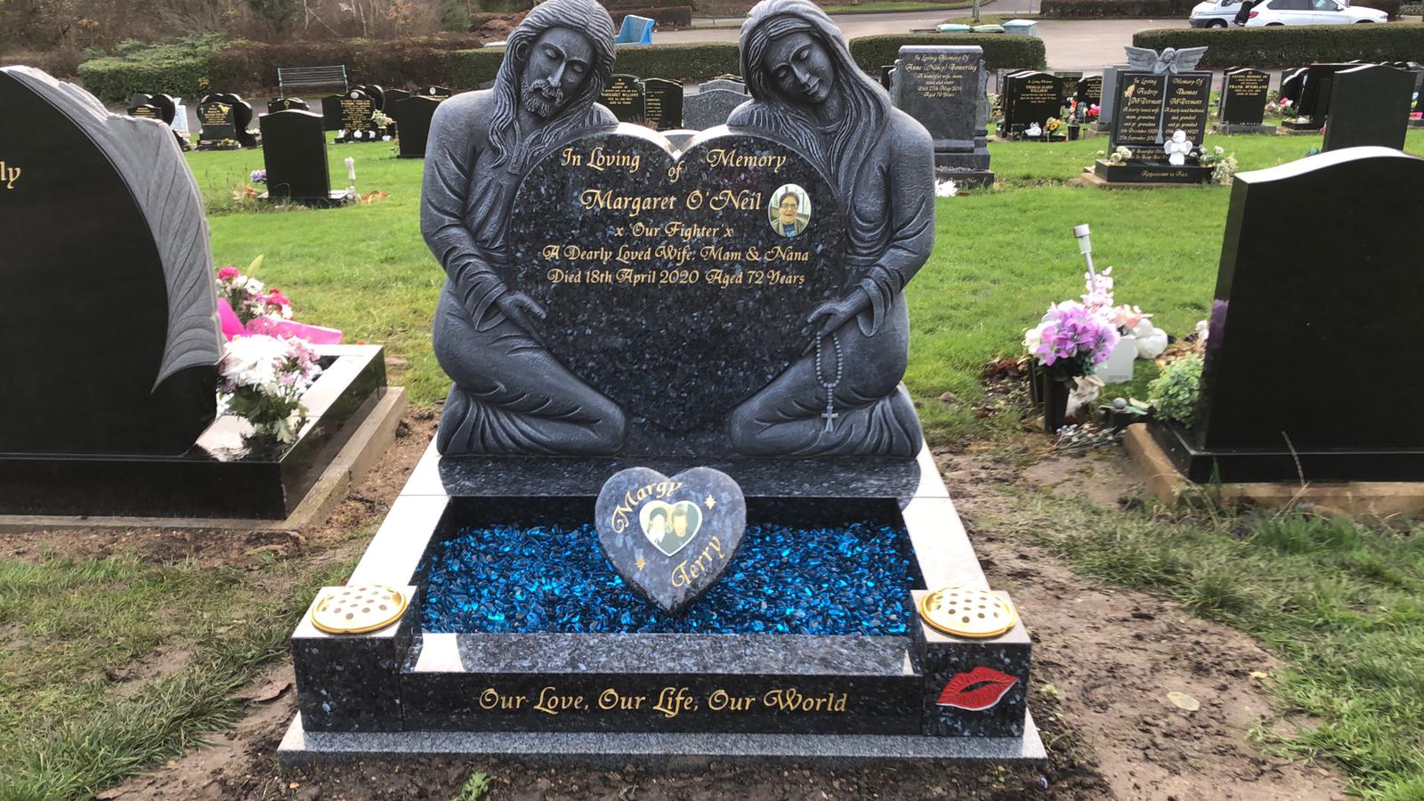 Beautiful granite memorial headstone with angel statues