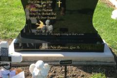 Granite headstone with cross motif
